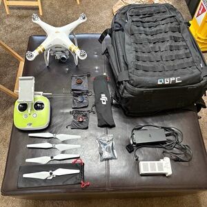 DJI White Drone with Gold Accents 1 working and the 2nd does not work(for parts)